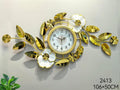 ساعة حائط ديكور فاخرة مقاس 106×50 سم – تصميم ورود وأوراق ذهبية لامعة