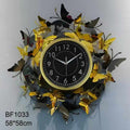 ساعة حائط ديكور فاخرة مقاس 60 سم – تصميم فراشات ذهبية وسوداء