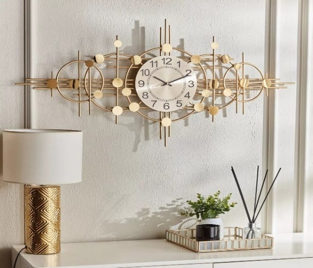 ساعة حائط دوائر هندسية ذهبية – 110×53 سم